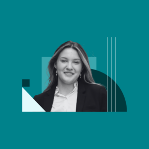 A young woman in a business suit smiles confidently. The portrait is in black and white with teal geometric shapes layered in the background.