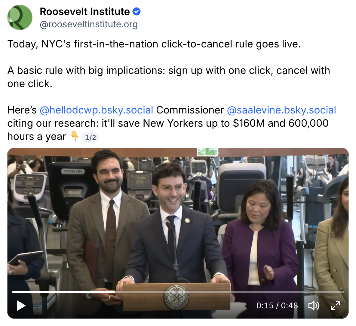 Three people stand at a podium during a press conference about the New York City click-to-cancel rule.